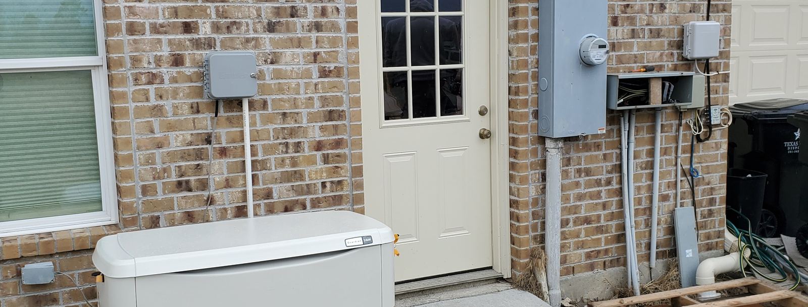 Standby generator and utility meter installed at a Cypress, TX home