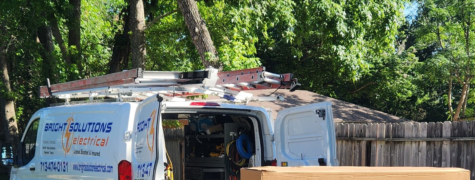 Bright Solutions Electrical service van loading a Generac generator for a Houston, TX installation