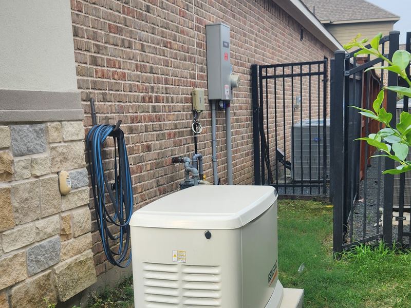 Standby generator installed beside a driveway
