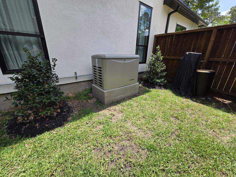 Kohler standby generator installed in a landscaped yard