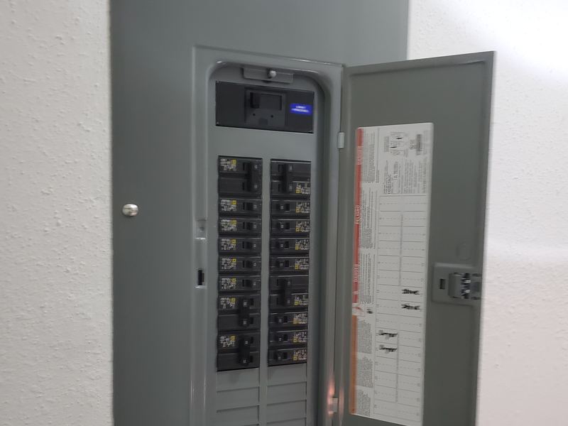 Open residential breaker panel with organized circuit breakers