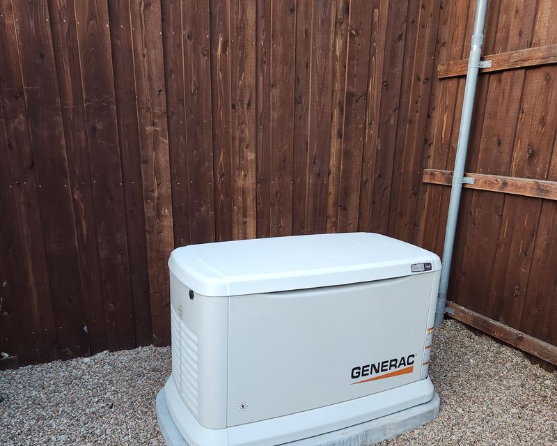 Generac standby generator installed on a concrete pad