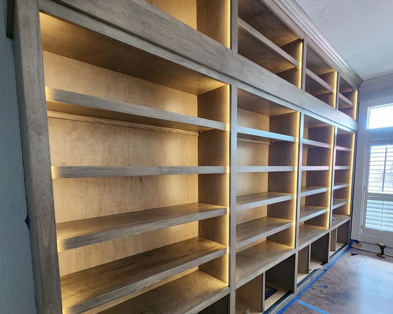 Custom built-in shelving with integrated LED accent lighting